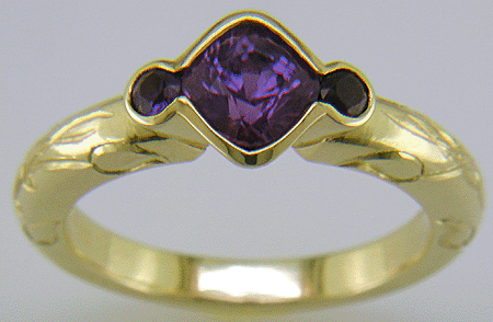 Cushion-cut Purple Sapphire with round Purple Sapphires in a custom platinum ring. (J8546)