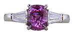 Purple Sapphire with tapered baguette diamonds in a custom platinum ring. (J8644)