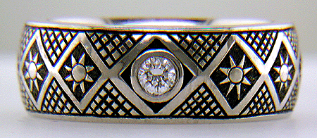 Hand engraved Pysanky ring with diamonds.