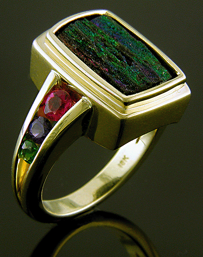 Rainbow hematite ring set with sapphires, tourmalines and tsavorites.