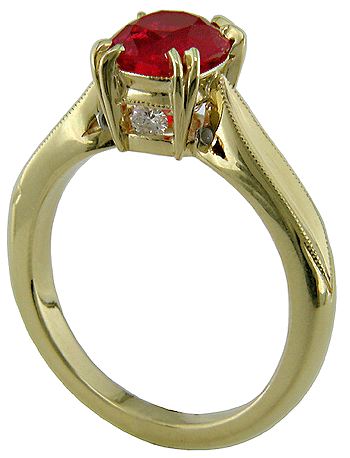 18kt gold ring with a red spinel and two diamonds.
