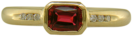 Emerald-cut Red Spinel set with round brilliant-cut diamonds in a handcrafted ring. (J6776)