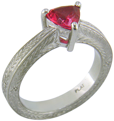 Hand engraved platinum ring with a trillium red spinel.