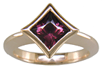 A Rhodolite Garnet set in a handcrafted rose gold ring. (J8701)