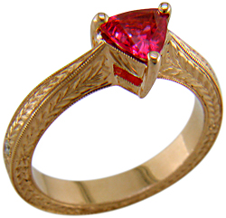 Engraved rose gold ring with red spinel.