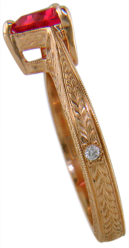 Hand engraved rose gold ring with a trillium red spinel.