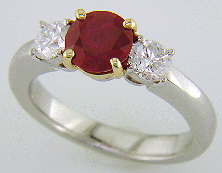 Round ruby and diamond ring in platinum.