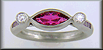 Hand-crafted platinum ring set with a Rubellite Tourmaline and diamonds. (J6651)