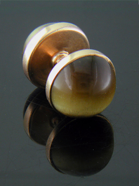Sansbury & Nellis Tiger Eye cufflinks crafted in 14kt gold. (J9207)