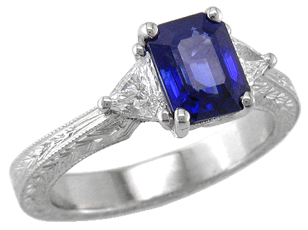 Sapphire and trilliant diamond platinum hand engraved ring.