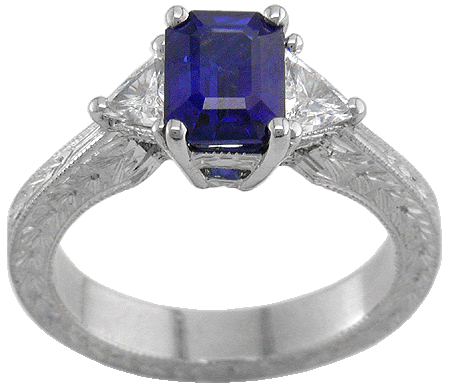 Sapphire and trilliant diamond platinum hand engraved ring.