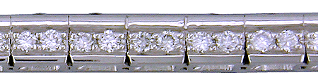 Close-up of brillinat-cut diamonds bead-set in the side walls of the platinum box links. (J5418)