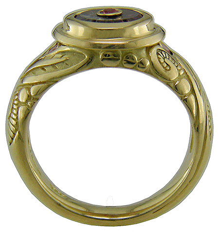 Torus-cut sapphire set in 18kt gold ring.