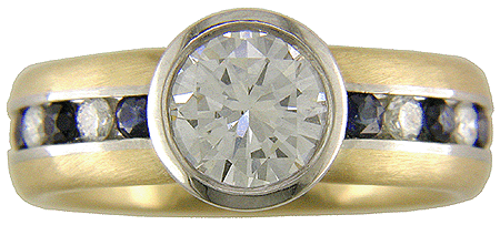 Custom diamond and sapphire ring crafted in platinum and gold.