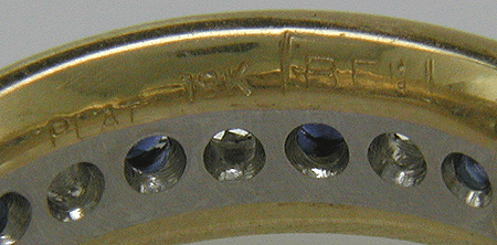 Close-up of Bijoux Extraordinaire hallmark, 'BEL'.