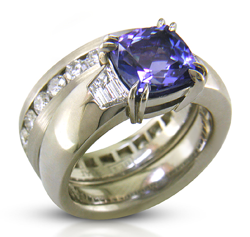 Custom tanzanite and diamond engagement ring and wedding band.