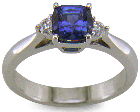 Square Cushion-cut Sapphire set with two round diamonds in a handcrafted platinum ring. (J8599)