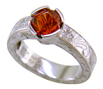 Hand-engraved Spessartitie Garnet ring.