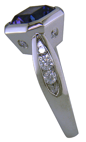 Side view of channel-set diamonds in tanzanite platinum ring.