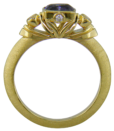 Hand-crafted 18kt gold tanzanite and diamond ring.