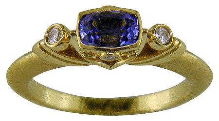 Hand-crafted 18kt gold tanzanite and diamond ring.