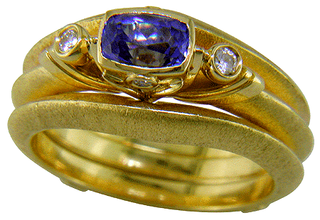 Hand-crafted 18kt gold tanzanite and diamond ring.