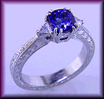 Hand-engraved platinum ring with Tanzanite and Diamonds.