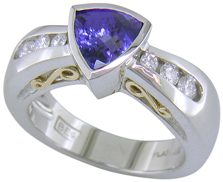 Channel set diamonds in trillium tanzanite platinum ring.