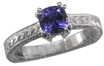 Tanzanite ring in hand engraved platinum.