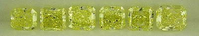 Line up of six fancy yellow diamonds.