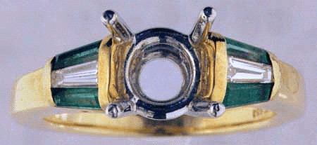 Yellow Gold engagement setting with tapered baguette diamonds and emeralds.