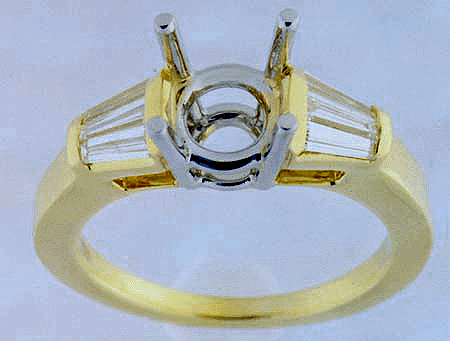 Yellow Gold Engagement ring with tapered diamond baguettes.