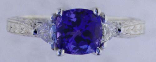 Engraved platinum ring with tanzanite and diamonds.