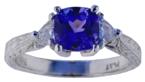 Engraved platinum ring with tanzanite and diamonds.