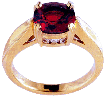 18kt gold ring with a red spinel and two diamonds.